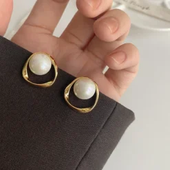Imitation-Pearl-Earring-for-Women-Gold-Color-Round-Stud-Earrings-Korean-Delicate-Irregular-Design-Unusual-2023-1.webp